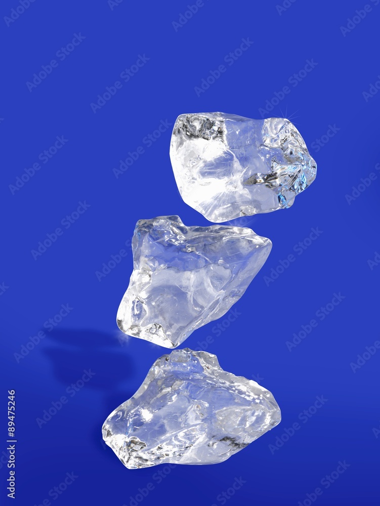Fototapeta premium Three ice cubes on blue background