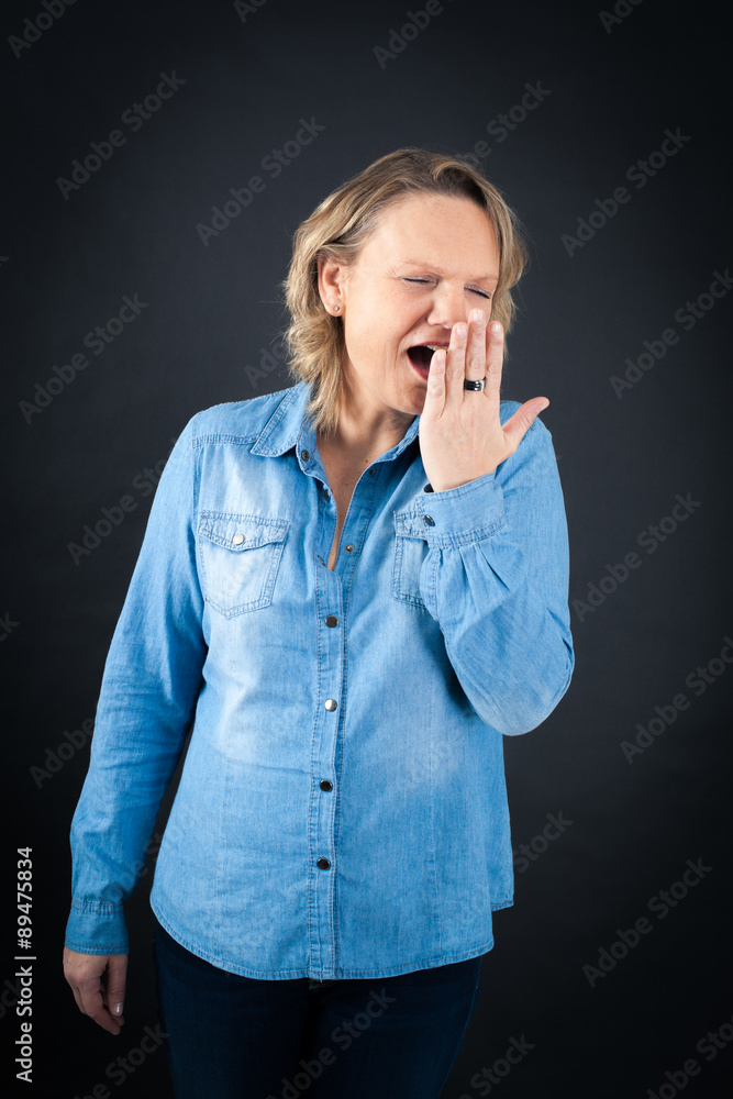 Beautiful woman doing different expressions in different sets of clothes: yawn Beautiful woman doing different expressions in different sets of clothes: yawn