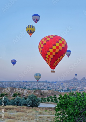 Hot air balloons flying over Goreme Cappadocia Turkey
