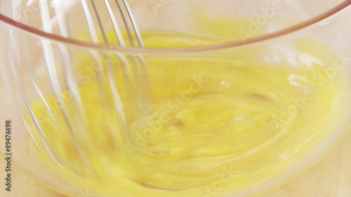 Ingredients for mayonnaise being mixed with a whisk