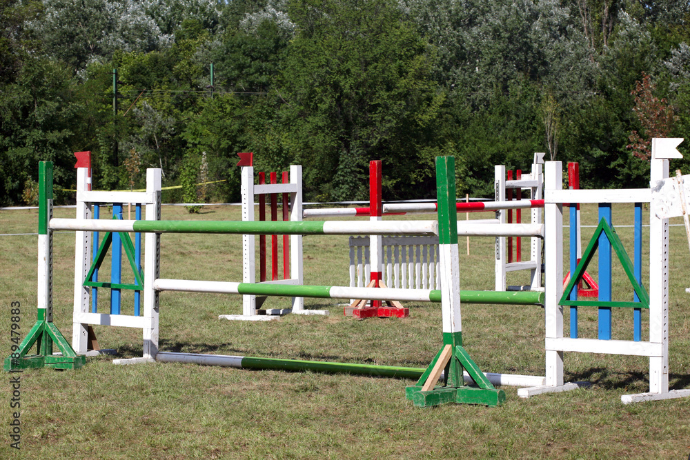 Equitation obstacles and barriers on a show jumping event Equitation obstacles and barriers on a show jumping event