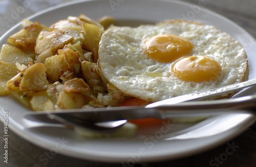 Fried egg with fried potatoes