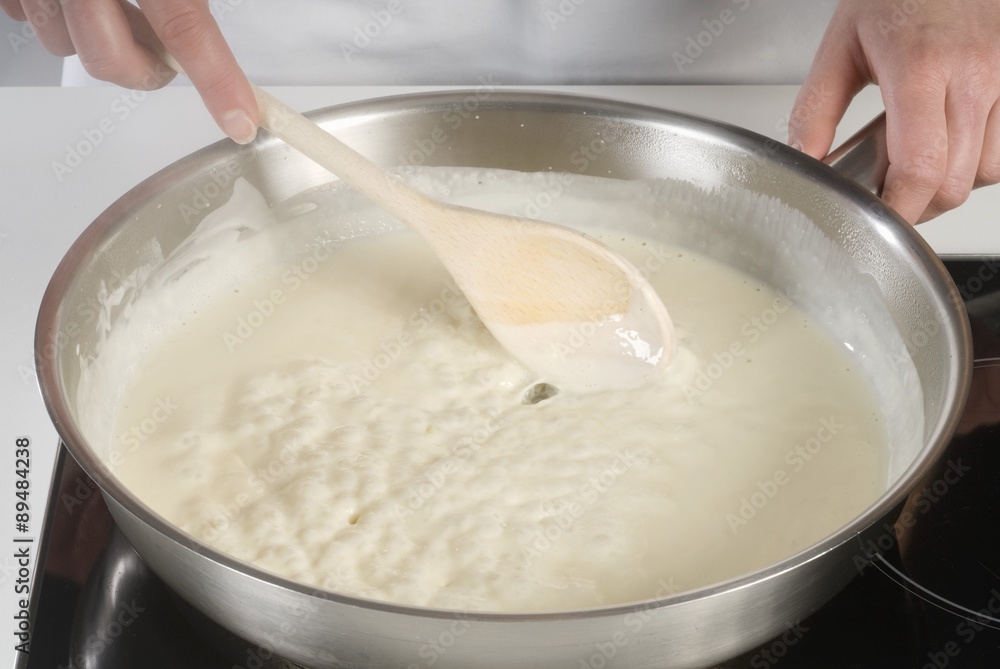 Fototapeta premium Making cream sauce for spaghetti