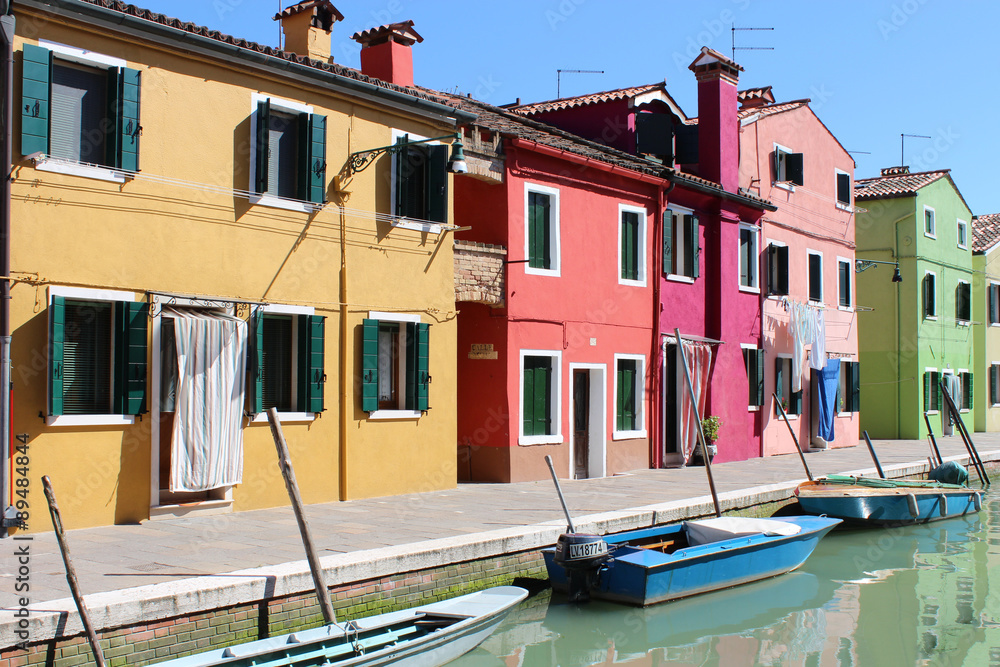 Coloured houses at a canal in Murano Italy