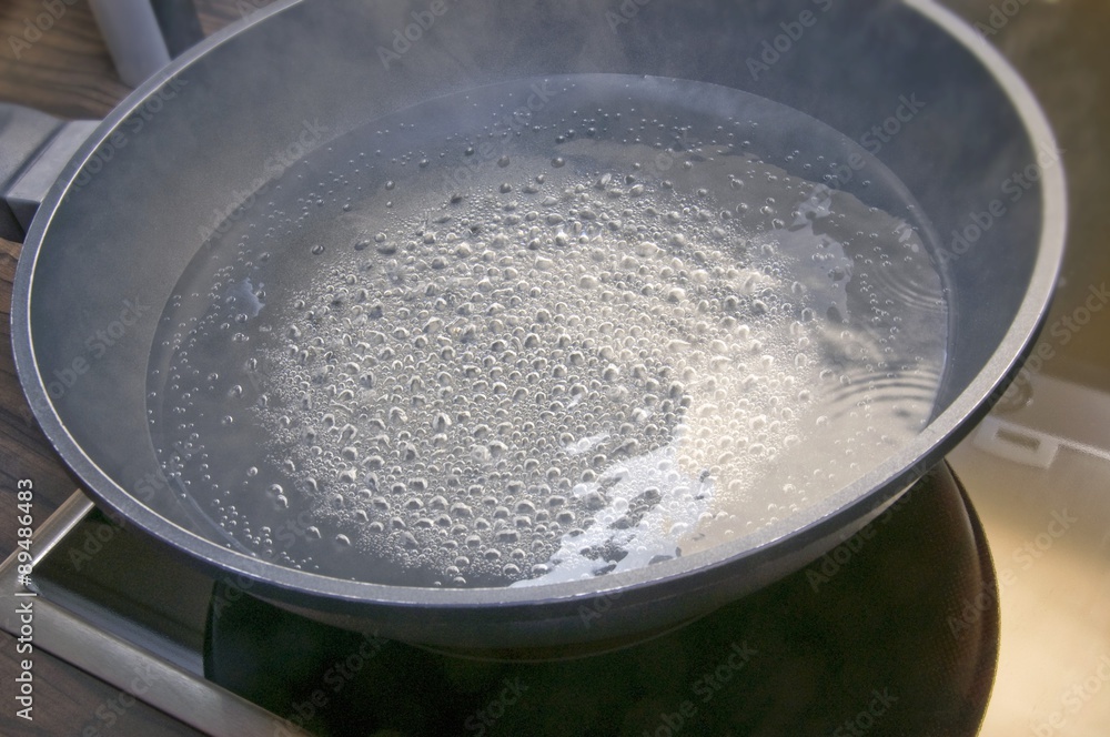 Boiling water in a wok Stock Photo | Adobe Stock