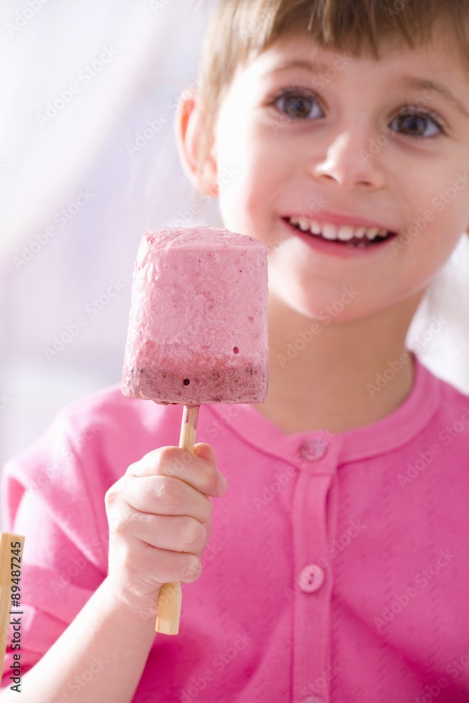 Girl with raspberry yoghurt ice cream Girl with raspberry yoghurt ice cream