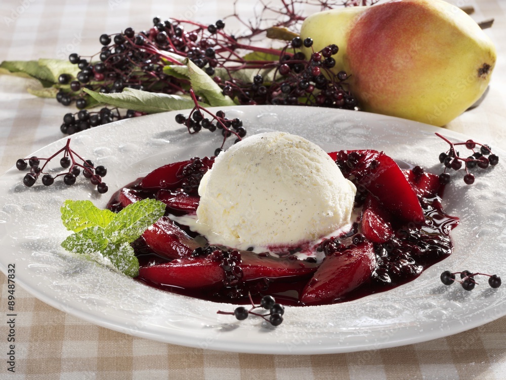 Fototapeta premium Vanilla ice cream on stewed elderberries and pears