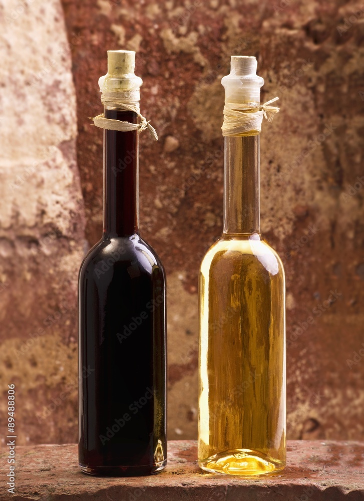Oil and vinegar bottles on brick Oil and vinegar bottles on brick
