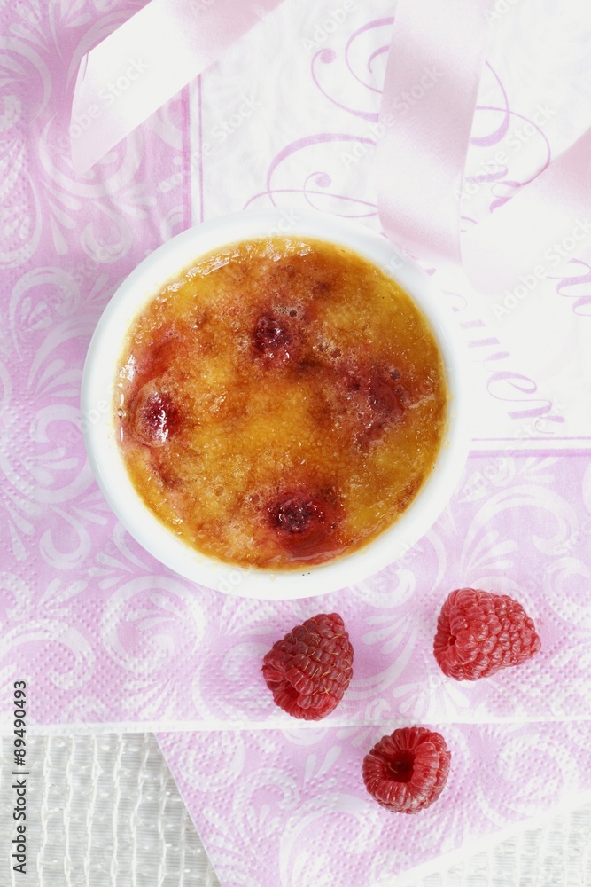 Creme brulee with raspberries (seen from above) Creme brulee with raspberries (seen from above)