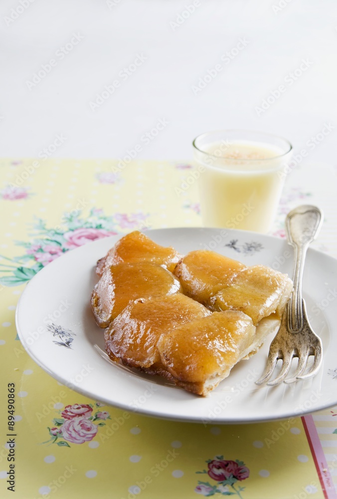 A slice of tarte tatin on a plate A slice of tarte tatin on a plate