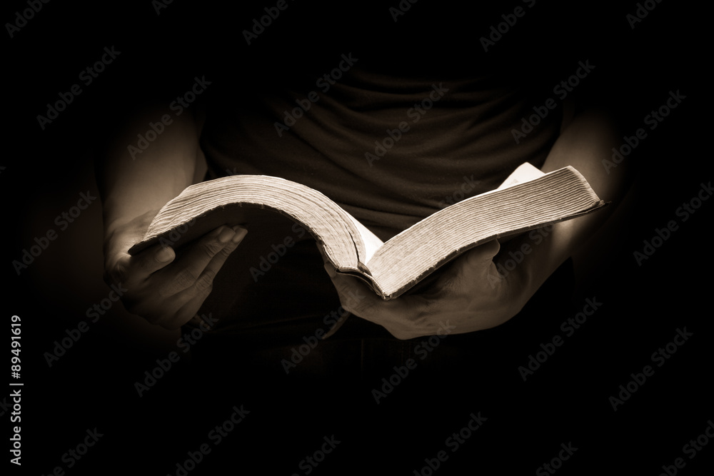 Fototapeta premium A man reading the Holy Bible.