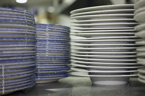 Stacks of plates in a commercial kitchen