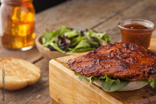 Barbecue Chicken Sandwich; Salad; Iced Tea in a Mason Jar