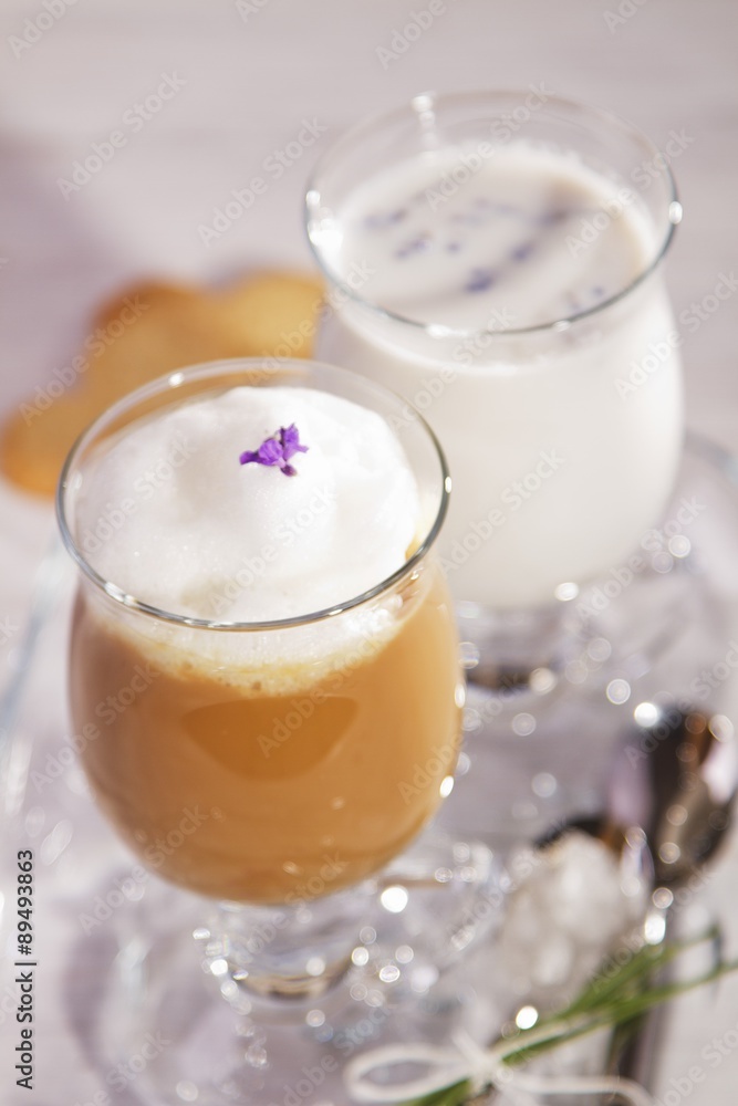 A cafe latte and a glass of milk A cafe latte and a glass of milk