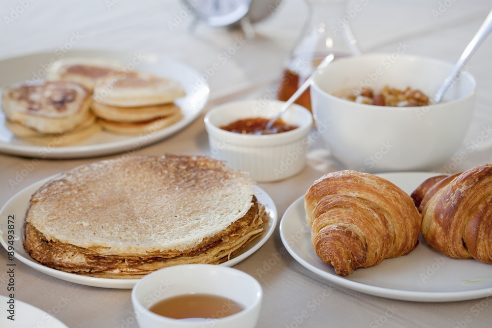 A breakfast of pancakes, croissants and flapjacks A breakfast of pancakes, croissants and flapjacks