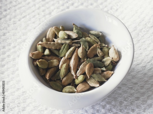 A bowl of cardamom pods