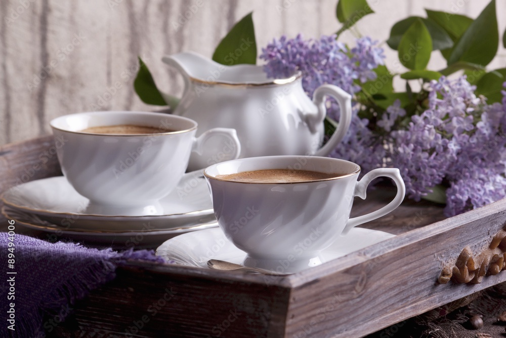 Cups of coffee and a jug of milk Cups of coffee and a jug of milk