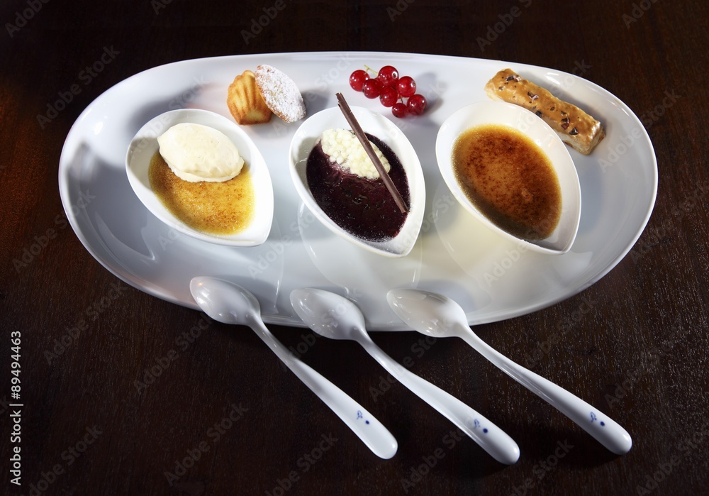 Three different flavours of creme brulee tonka beans, cassis and vanilla Stock Photo Adobe Stock