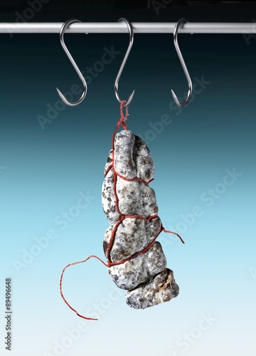 Tableau sur toile Salami hanging from a hook