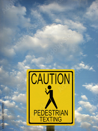 aged and worn vintage photo of people texting road sign photo