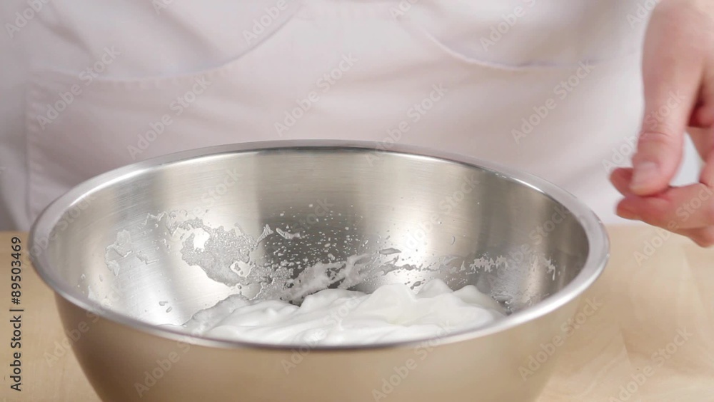 Egg white being beaten with a hand mixer Egg white being beaten with a hand mixer