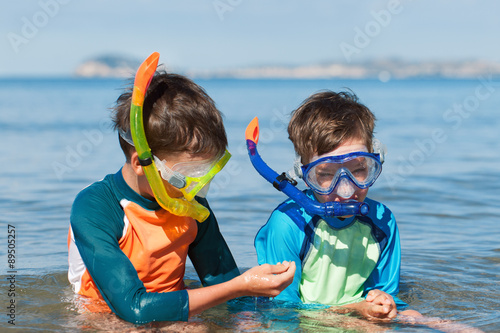 Portrait of happy cute boys wearing snorkeling mask