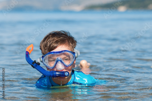 Portrait of happy cute boy wearing snorkeling mask