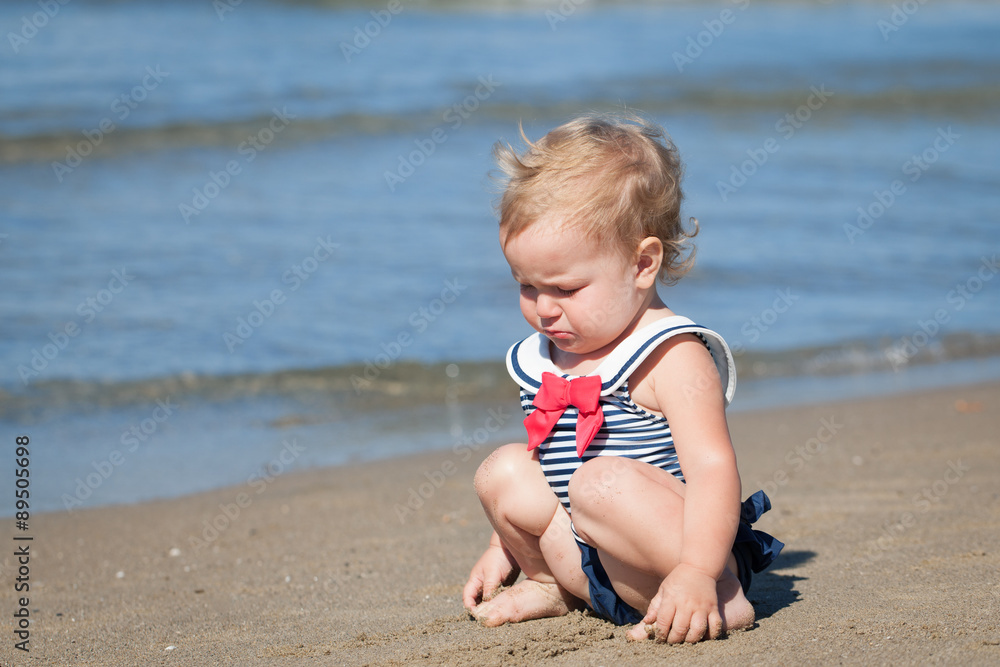 Portrait of crying girl in swimsuit on beach Portrait of crying girl in swimsuit on beach