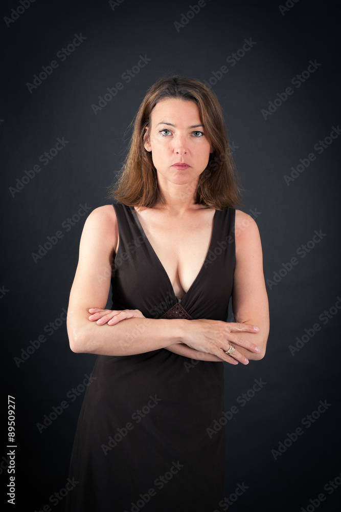Beautiful woman doing different expressions in different sets of clothes: arms crossed Beautiful woman doing different expressions in different sets of clothes: arms crossed