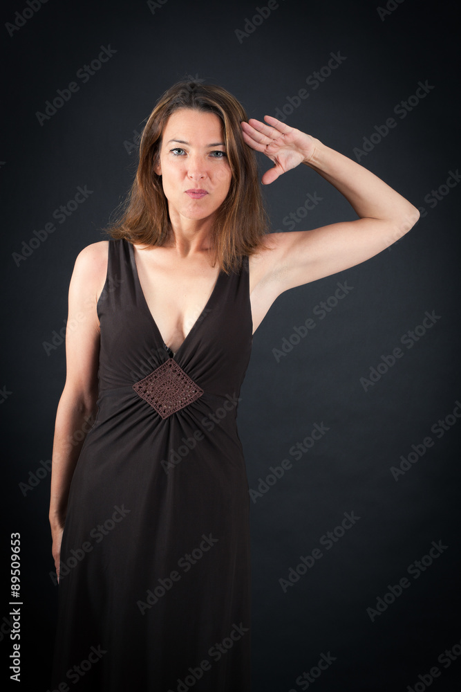 Beautiful woman doing different expressions in different sets of clothes: at attention Beautiful woman doing different expressions in different sets of clothes: at attention