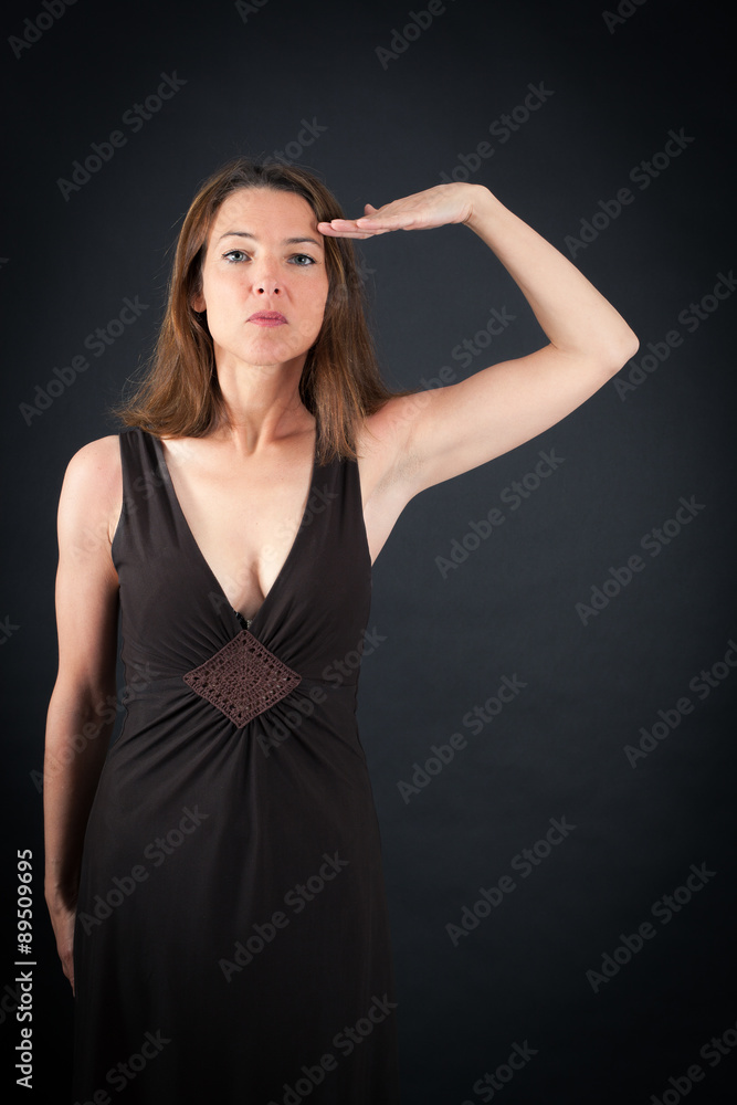 Beautiful woman doing different expressions in different sets of clothes: at attention Beautiful woman doing different expressions in different sets of clothes: at attention