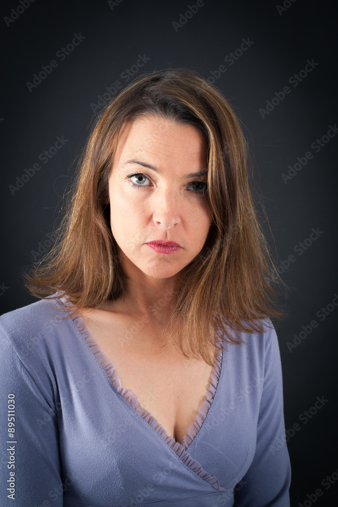 Beautiful woman doing different expressions in different sets of clothes: angry Beautiful woman doing different expressions in different sets of clothes: angry