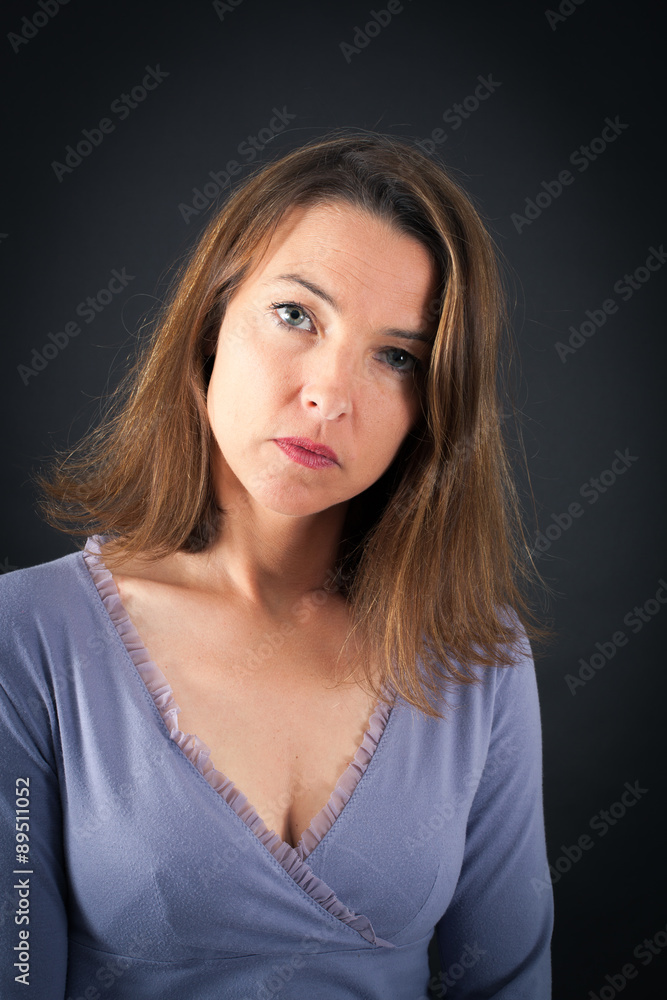 Beautiful woman doing different expressions in different sets of clothes: sad Beautiful woman doing different expressions in different sets of clothes: sad