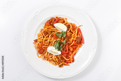 traditional uzbek lagman meal on white plate isolated
