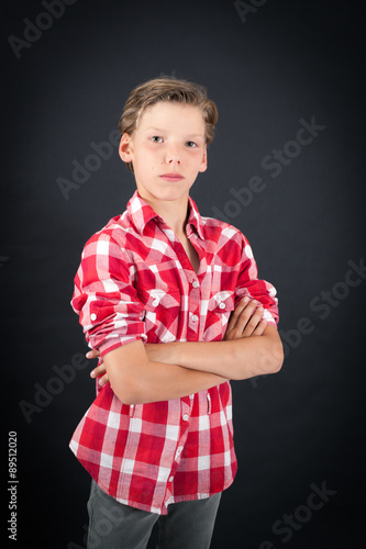 Wallpaper Mural Handsome boy doing different expressions in different sets of clothes: arms crossed Torontodigital.ca
