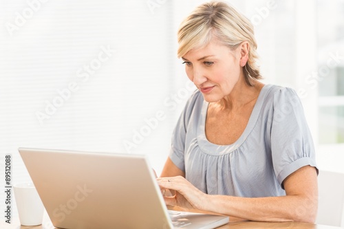Attentive businesswoman working on a laptop