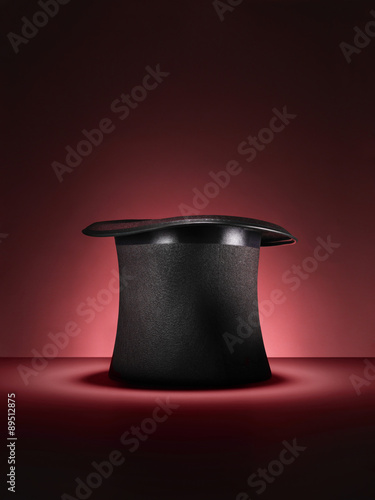 magic top hat on red - Stock Image
