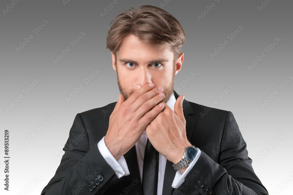 Businessman closing mouth with hands. Shut up Businessman closing mouth with hands. Shut up