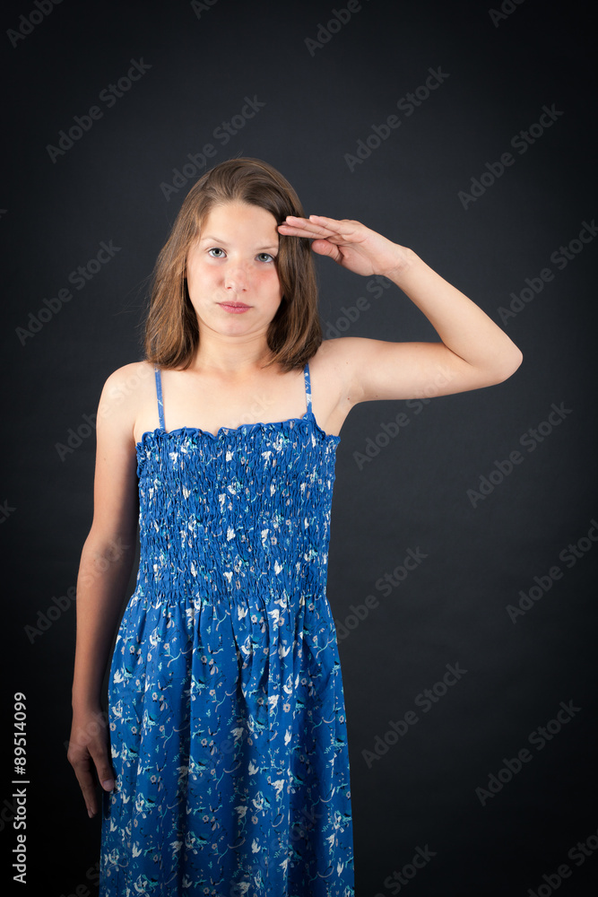 Beautiful girl doing different expressions in different sets of clothes: at attention Beautiful girl doing different expressions in different sets of clothes: at attention