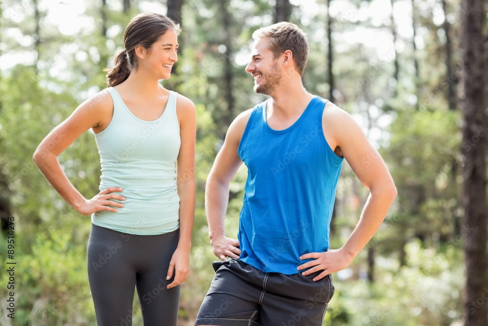 Happy joggers looking at each other Happy joggers looking at each other