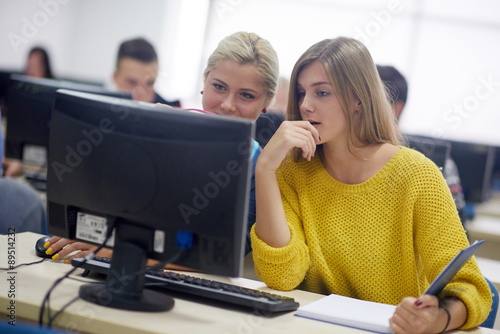 students group in computer lab classroom