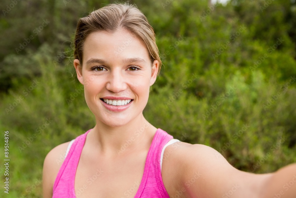 Pretty blonde athlete smiling and taking selfie Pretty blonde athlete smiling and taking selfie
