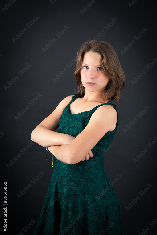 Beautiful girl doing different expressions in different sets of clothes: arms crossed Beautiful girl doing different expressions in different sets of clothes: arms crossed