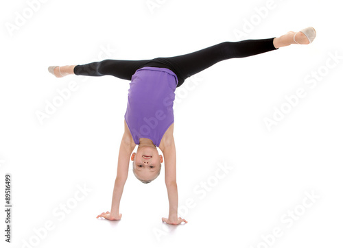 girl stands on her hands