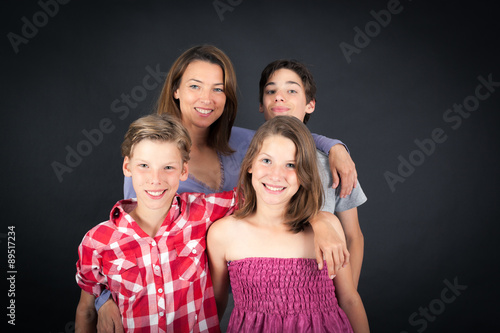 Beautiful family doing different expressions in different sets of clothes: smile