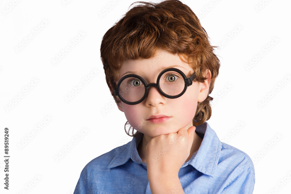 Portrait of handsome thoughtful boy in round glasses. Isolated