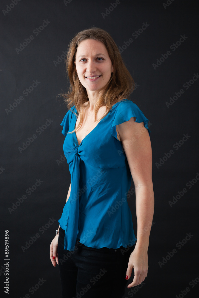 Beautiful woman doing different expressions in different sets of clothes: smile Beautiful woman doing different expressions in different sets of clothes: smile