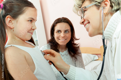 Wallpaper Mural Doctor examining a child in a hospital Torontodigital.ca