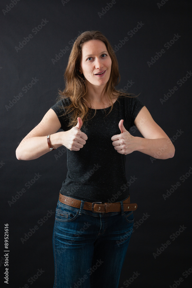 Beautiful woman doing different expressions in different sets of clothes: thumbs up Beautiful woman doing different expressions in different sets of clothes: thumbs up