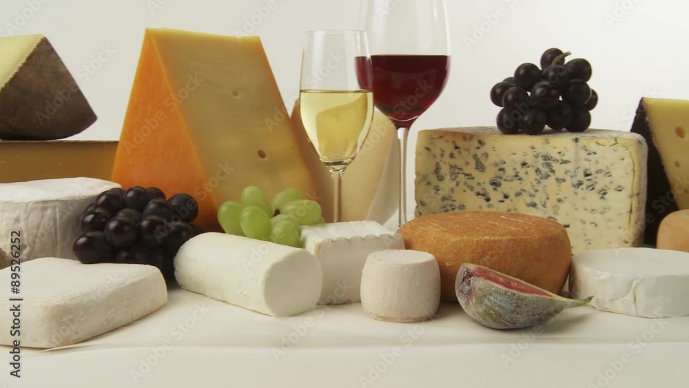 Various cheeses with wine and grapes Various cheeses with wine and grapes